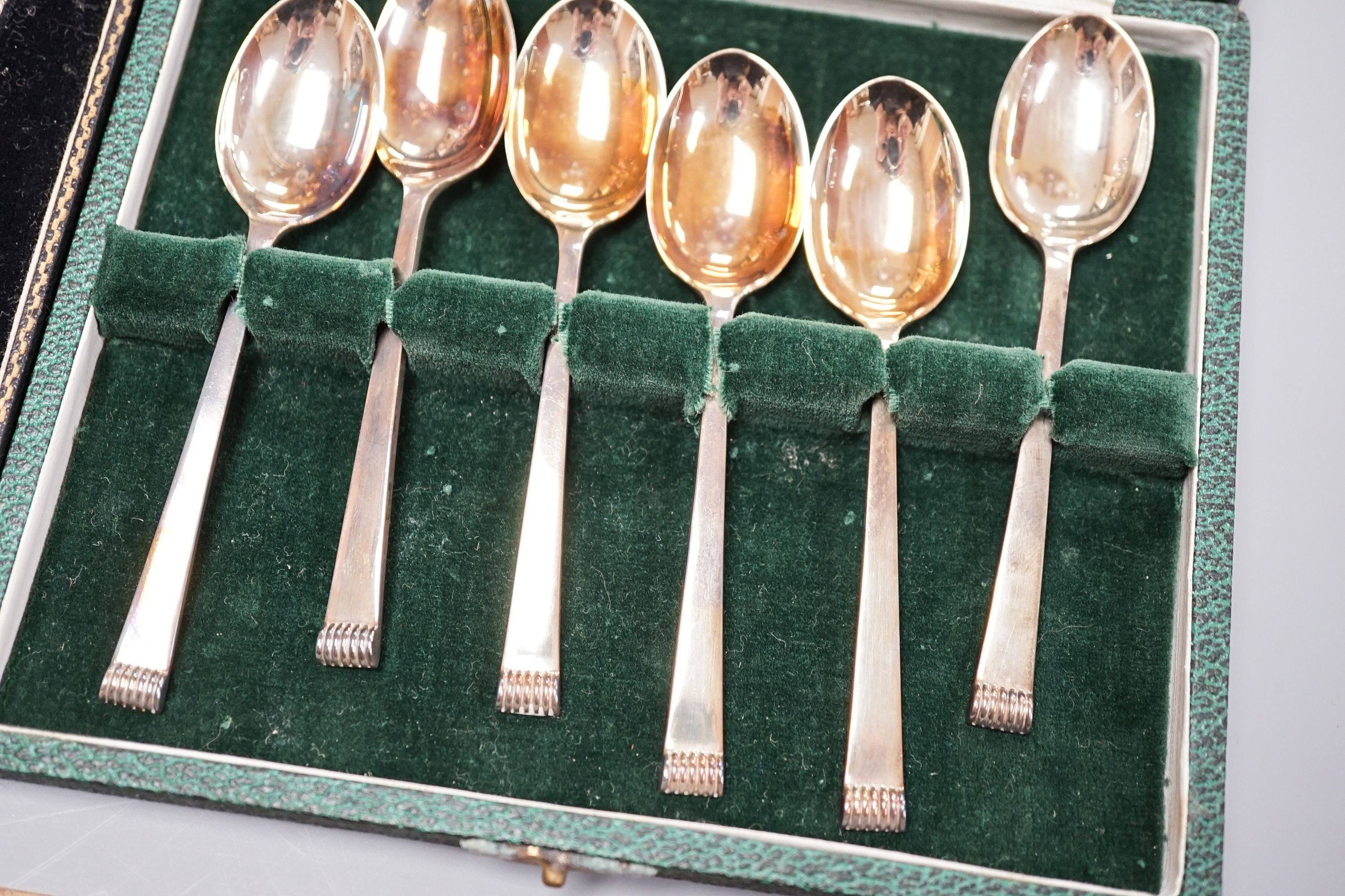 Seven assorted cased sets of English silver tea and coffee spoons, including a set of twelve silver gilt teaspoons, London, 1882 (one set incomplete).